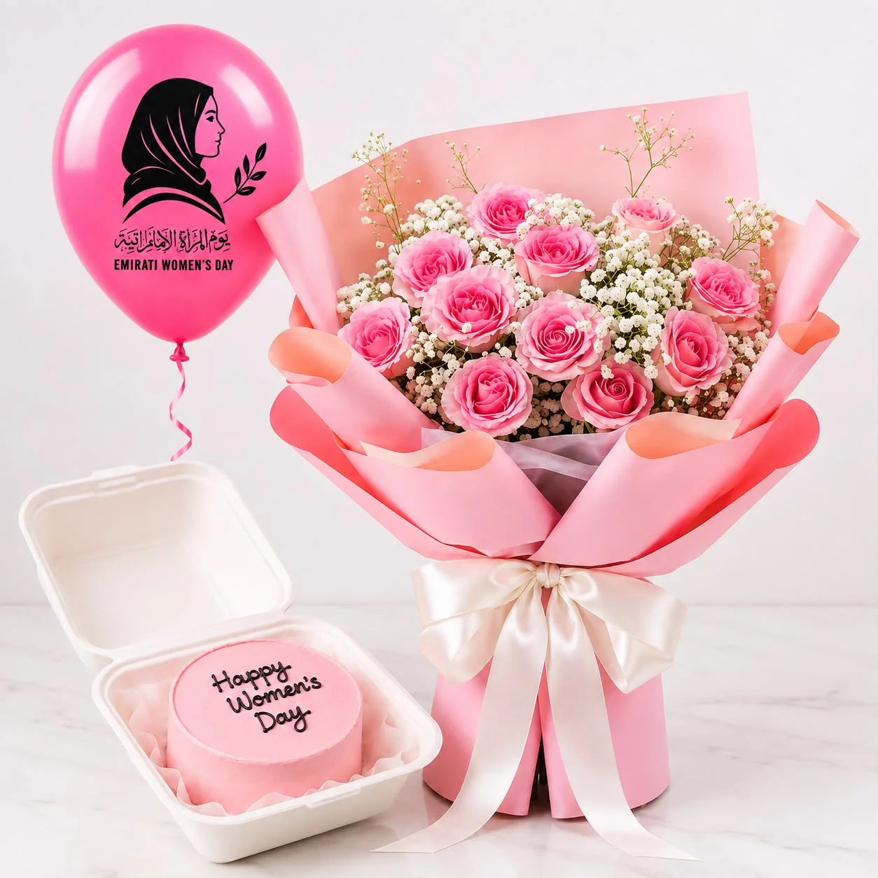 Emirati Women’s Day hamper with 11 pink roses, 200g bento cake and festive balloon for her
